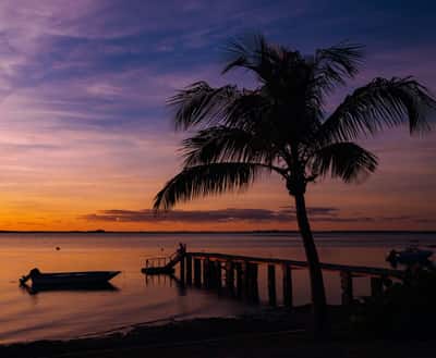 An image of a gorgeous purple sunset on Harbour Island, Bahamas.